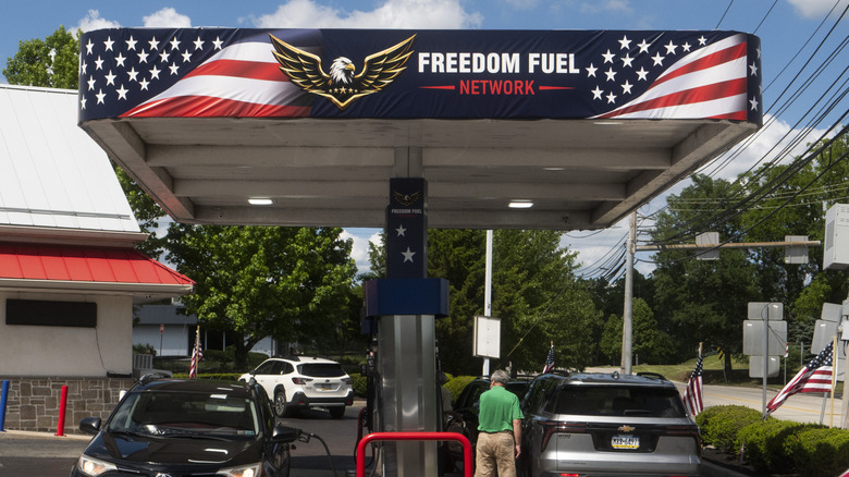Cars parked at a Freedom Fuel gas station.