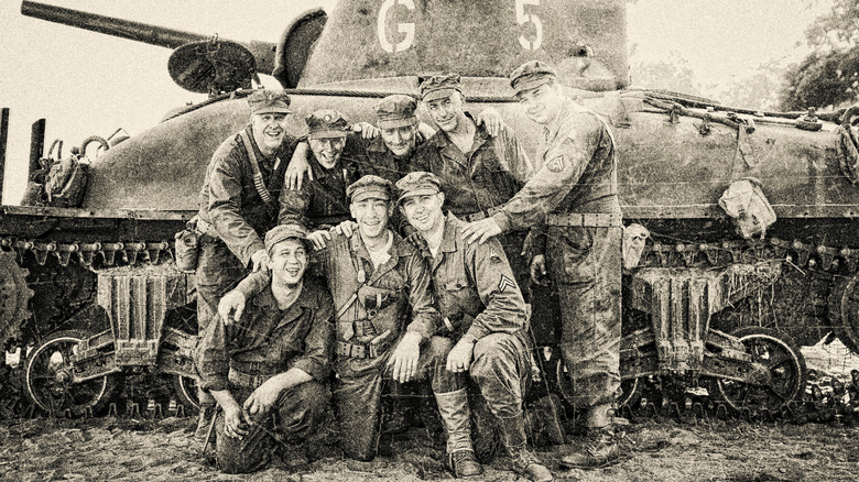 soldiers pose with Sherman tank