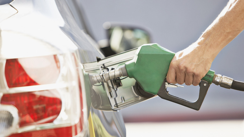 a gas pump in car's gas tank