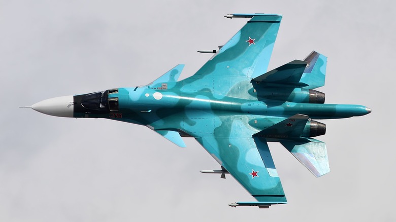 An Su-34 flying over cloudy skies