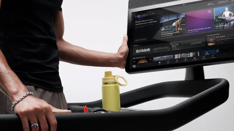 close up of a person using a Peloton Tread treadmill
