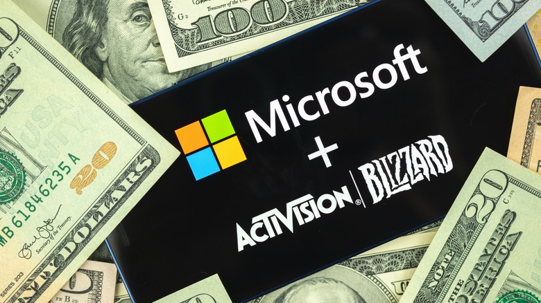 Microsoft and Activision Blizzard with dollar bills 