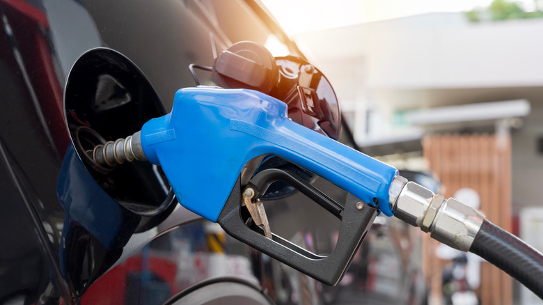 Car filling up at gas station