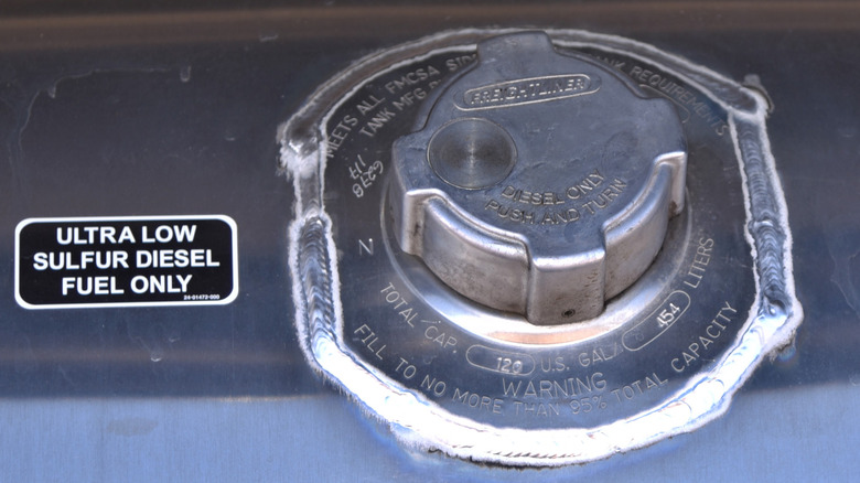 Close up of a diesel filler cap with a sticker saying 