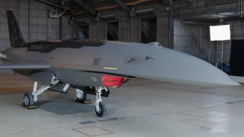 Front and side view of the The YFQ-44A Fury AAV in a hangar