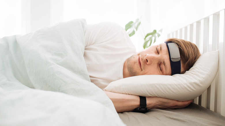Man sleeping with a headband on