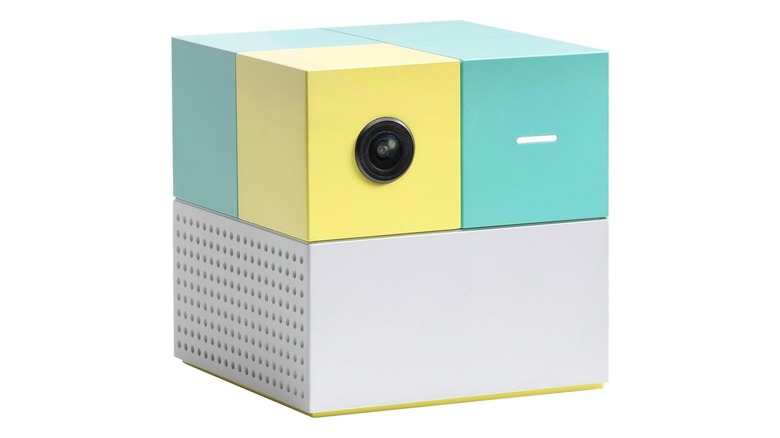 Cube-shaped device with a camera lens on one section