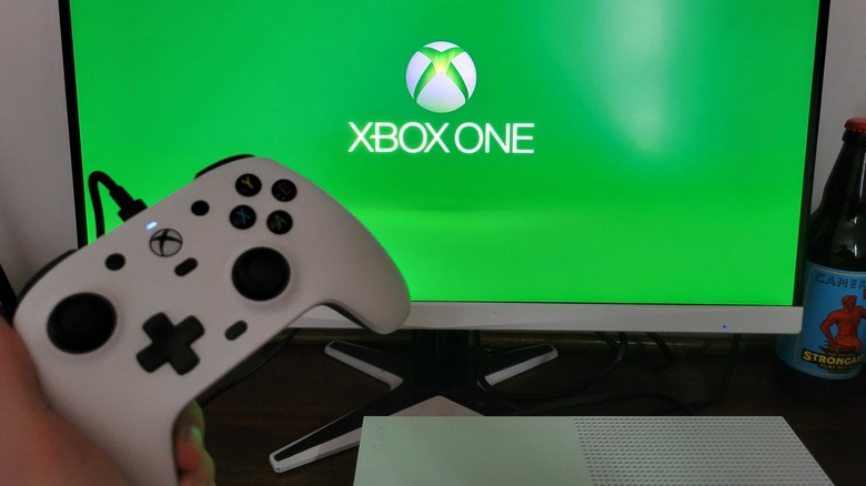 The controller in front of an Xbox loading screen