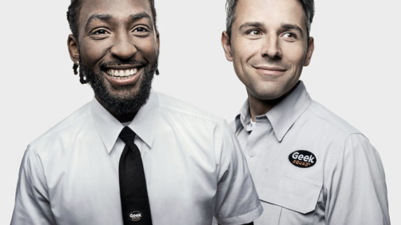 two Geek Squad employees smiling
