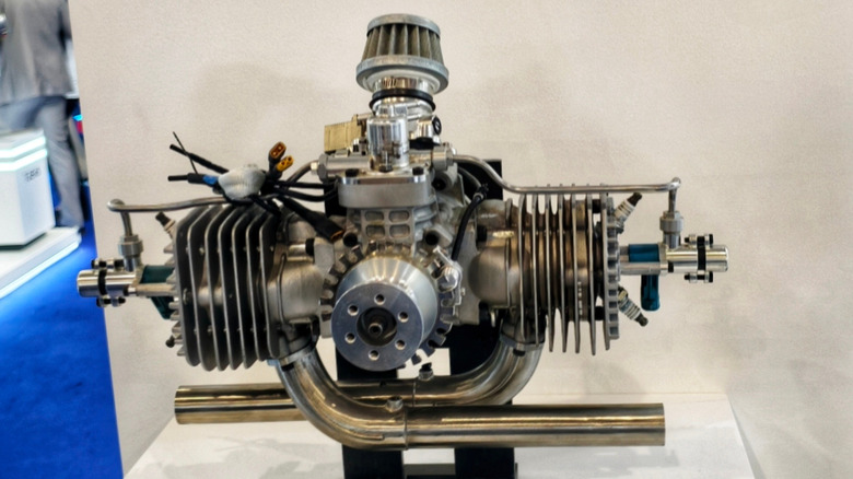 A two-stroke, air-cooled engine displayed at an auto expo