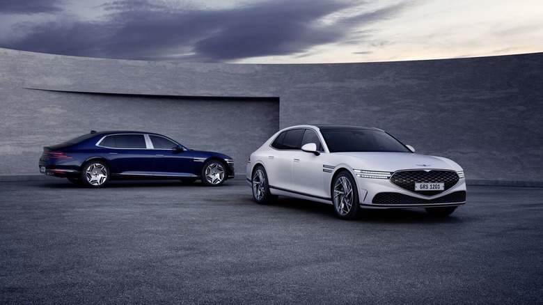 Blue and white Genesis G90s parked