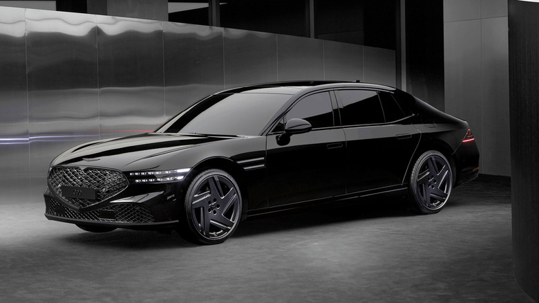 Black Genesis G90 next to a reflective wall