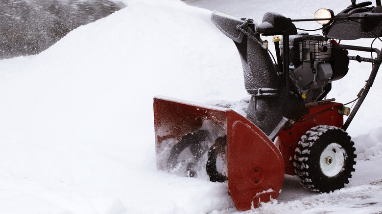 snow blower clearing driveway