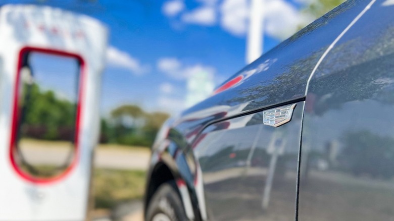 Cadillac parked at Tesla Supercharger