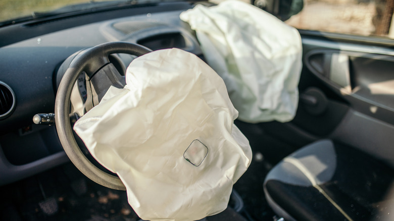 Car interior with airbags deployed