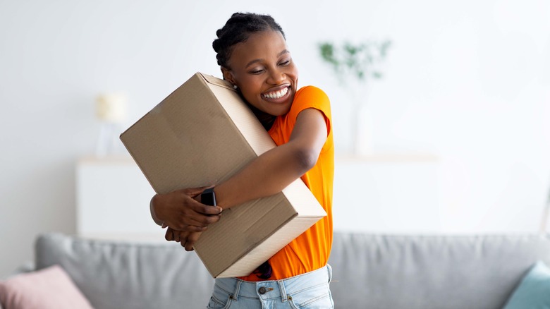 Woman hugs package