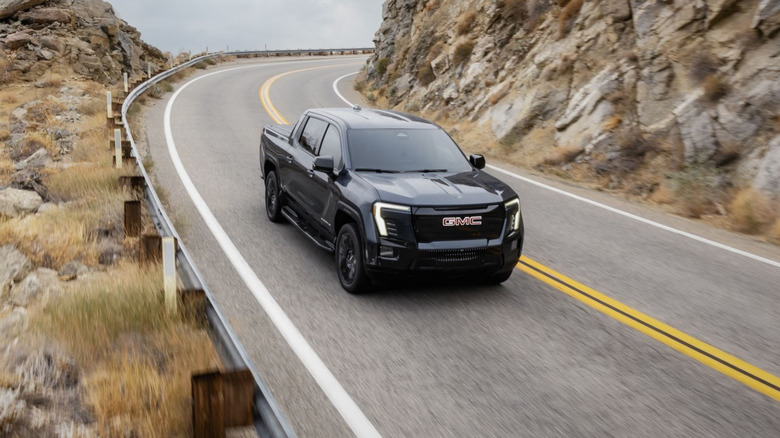 GMC Sierra EV on a winding mountain pass