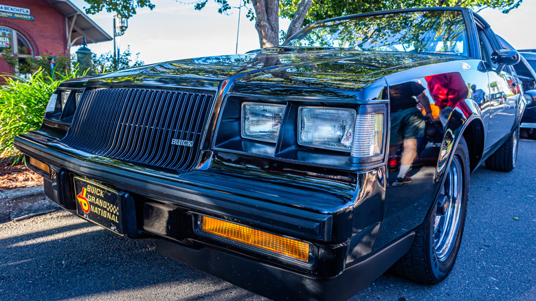 Wide angle low perspective front corner view of a 1987 Buick Grand National at a classic car show in Fernandina Beach, Florida.