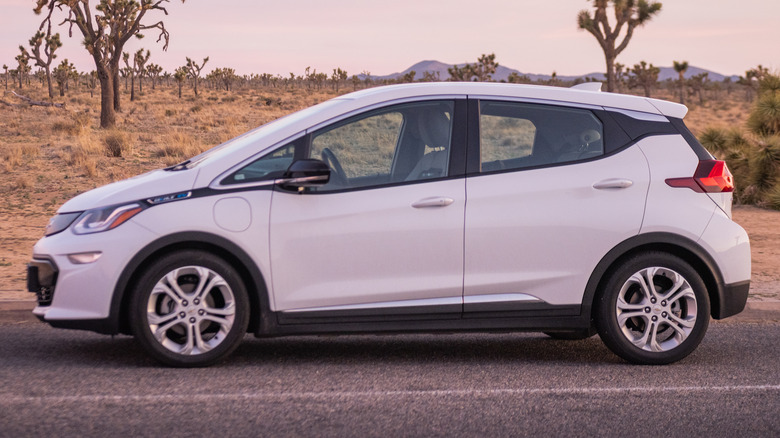 White Chevy Bolt on a rural road