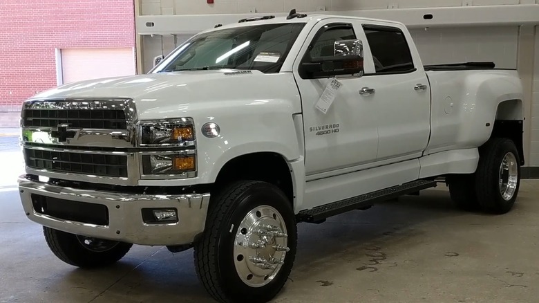 A white Chevy Silverado 4500 HD parked indoors.