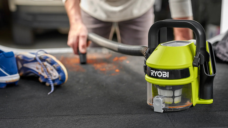 Ryobi GoGoVac cleaning a car's trunk
