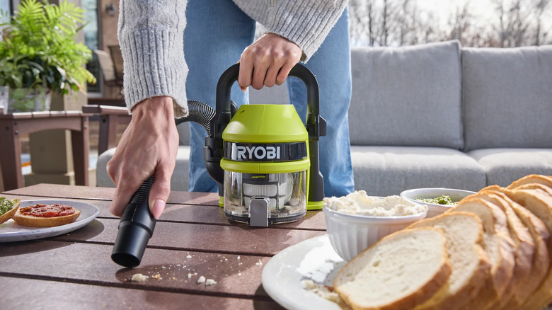 Ryobi GoGoVac clearing up crumbs on a table