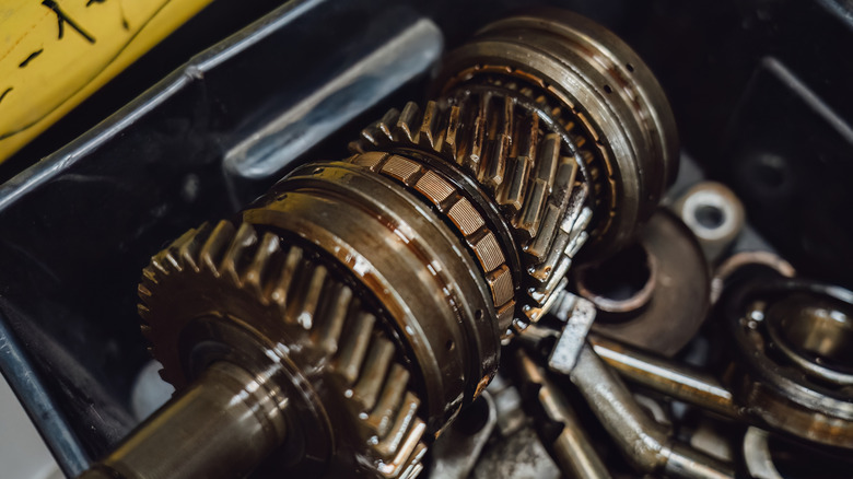 Well-lubricated metal parts inside a car's engine.