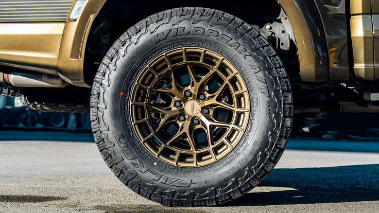 A bronze metallic pickup truck weaing Falken tires.