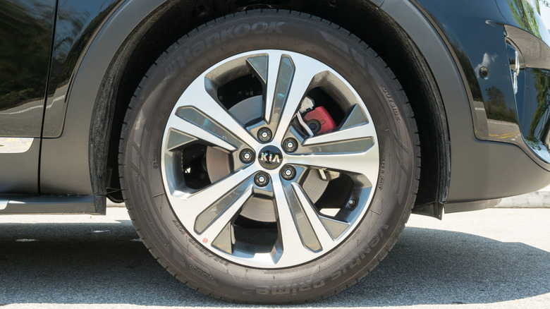 A black Kia SUV wearing Hankook tires.
