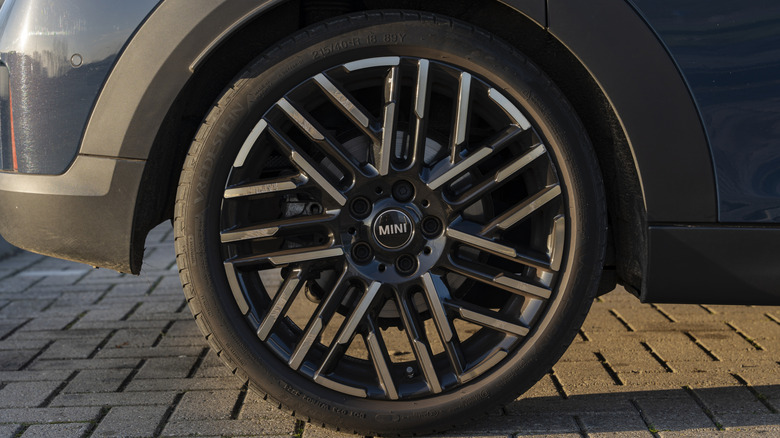 A gray Mini Cooper wearing Vredestein tires.