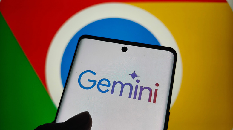 A smartphone showing Gemini in front of the Chrome logo.