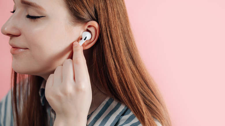 Woman uses AirPods