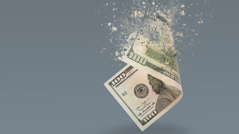 100 dollar bill disintegrating