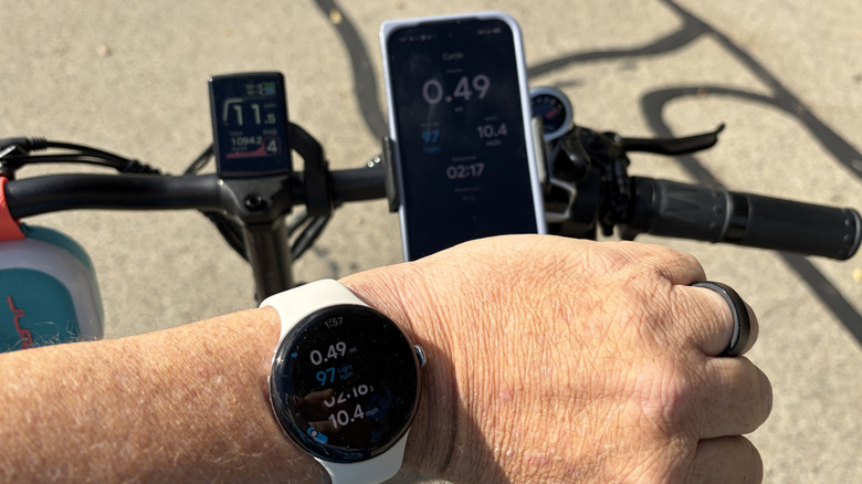 Man wearing a Pixel Watch 4 on a bike
