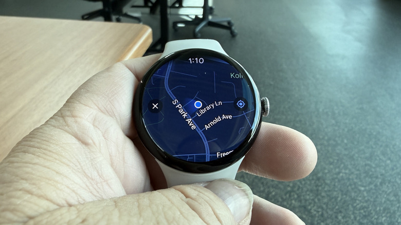 Man holding a Pixel Watch 4