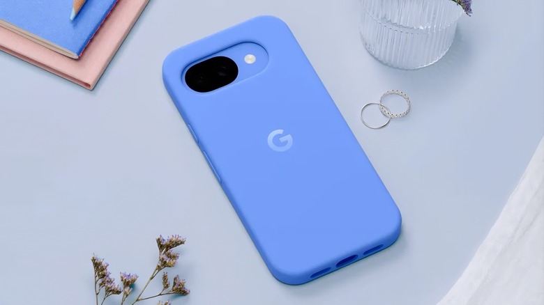 Pixel 10a inside a blue case on a table.