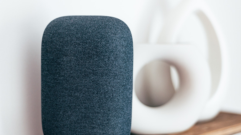 Google Nest Audio smart speaker on a shelf