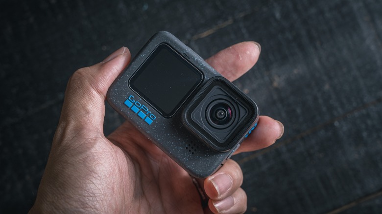 Hand holding GoPro 12