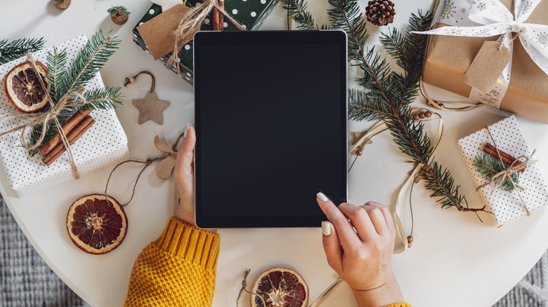 Woman using an iPad at Christmas