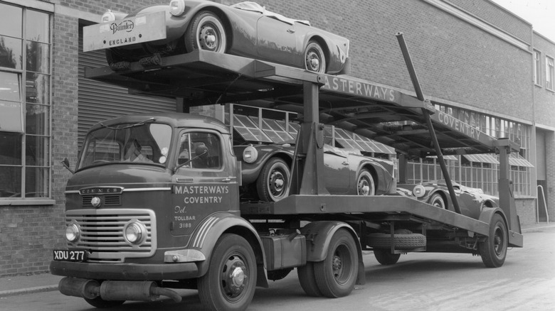 Daimler Dart SP250s on car transporter for delivery 1960
