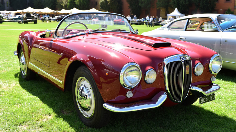 Red Lancia Aurelia B24 Spider convertible front 3/4