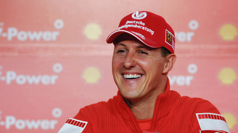 Michael Schumacher laughing in Ferrari outfit