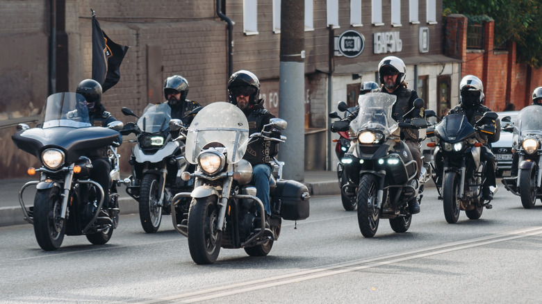 A group of fully kitted out bikers taking part in a motorcycle parade