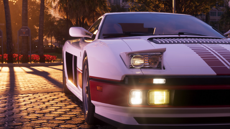 A sports car sits on cobblestone road at sunset in a screenshot from the video game Grand Theft Auto 6.
