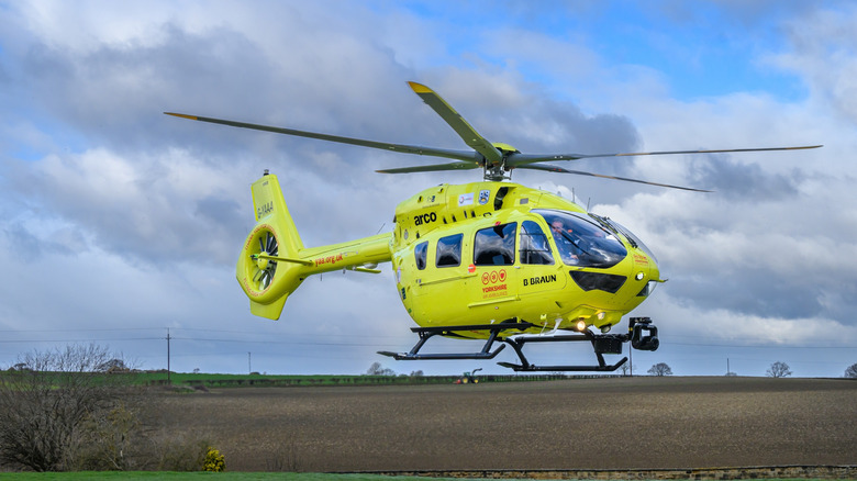 An Yorkshire Air Ambulance H145 hovering in the air.