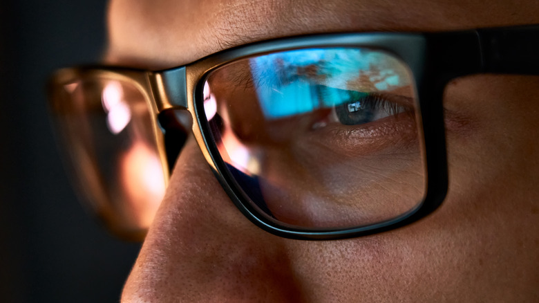 Computer screen reflected in glasses