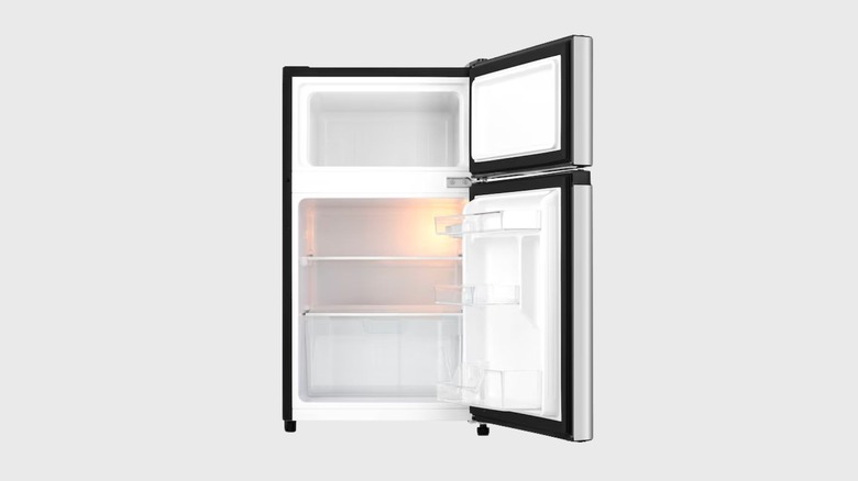 A Hisense Mini Fridge With Freezer with its door open, revealing the inside