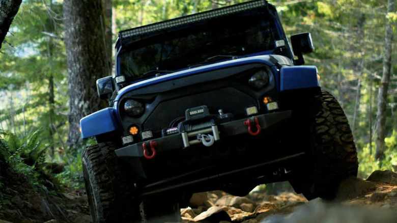 Badland winch on front bumper of blue Jeep Wrangler