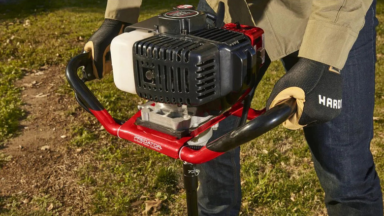 Man using Predator earth auger