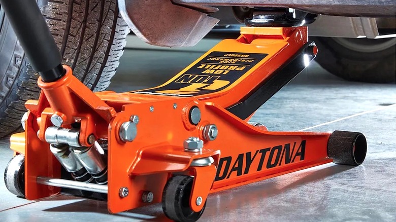 Daytona Jack holding up car with a Pinch Weld Adapter